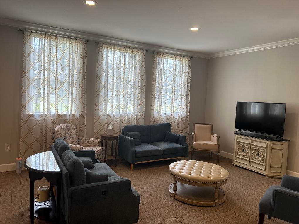 A church with rows of wooden benches and a podium