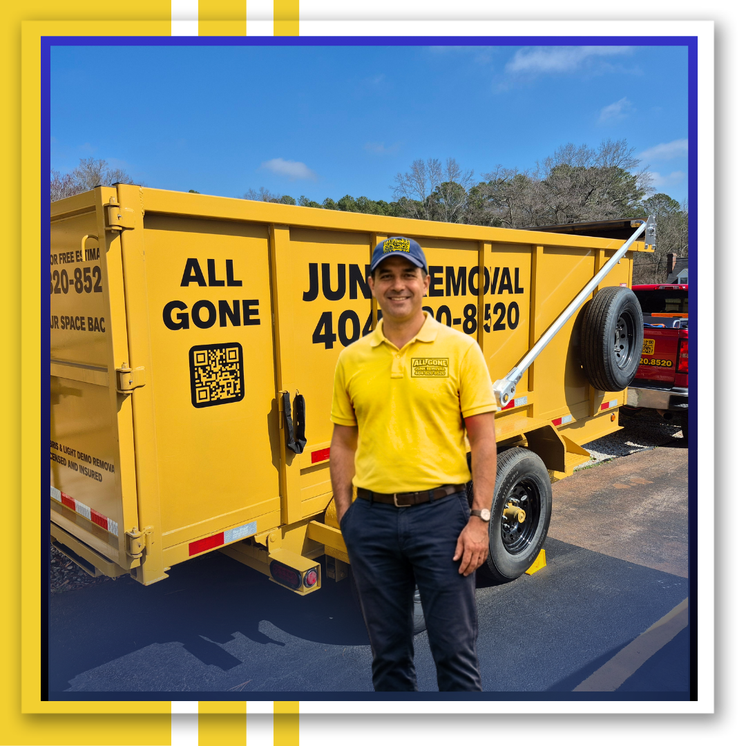 A man standing and a junk truck behind it.