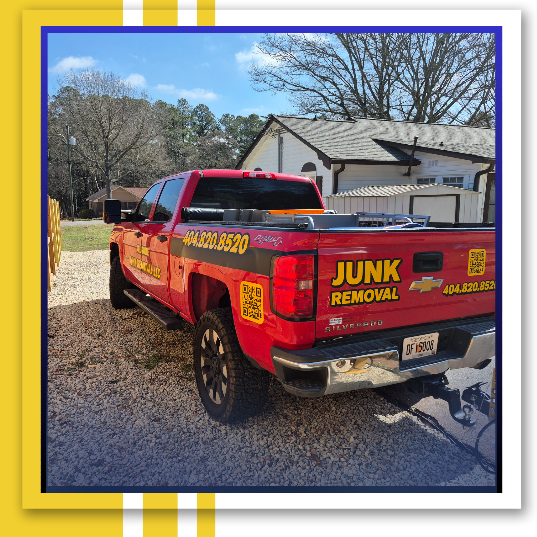 two men carrying an old sofa