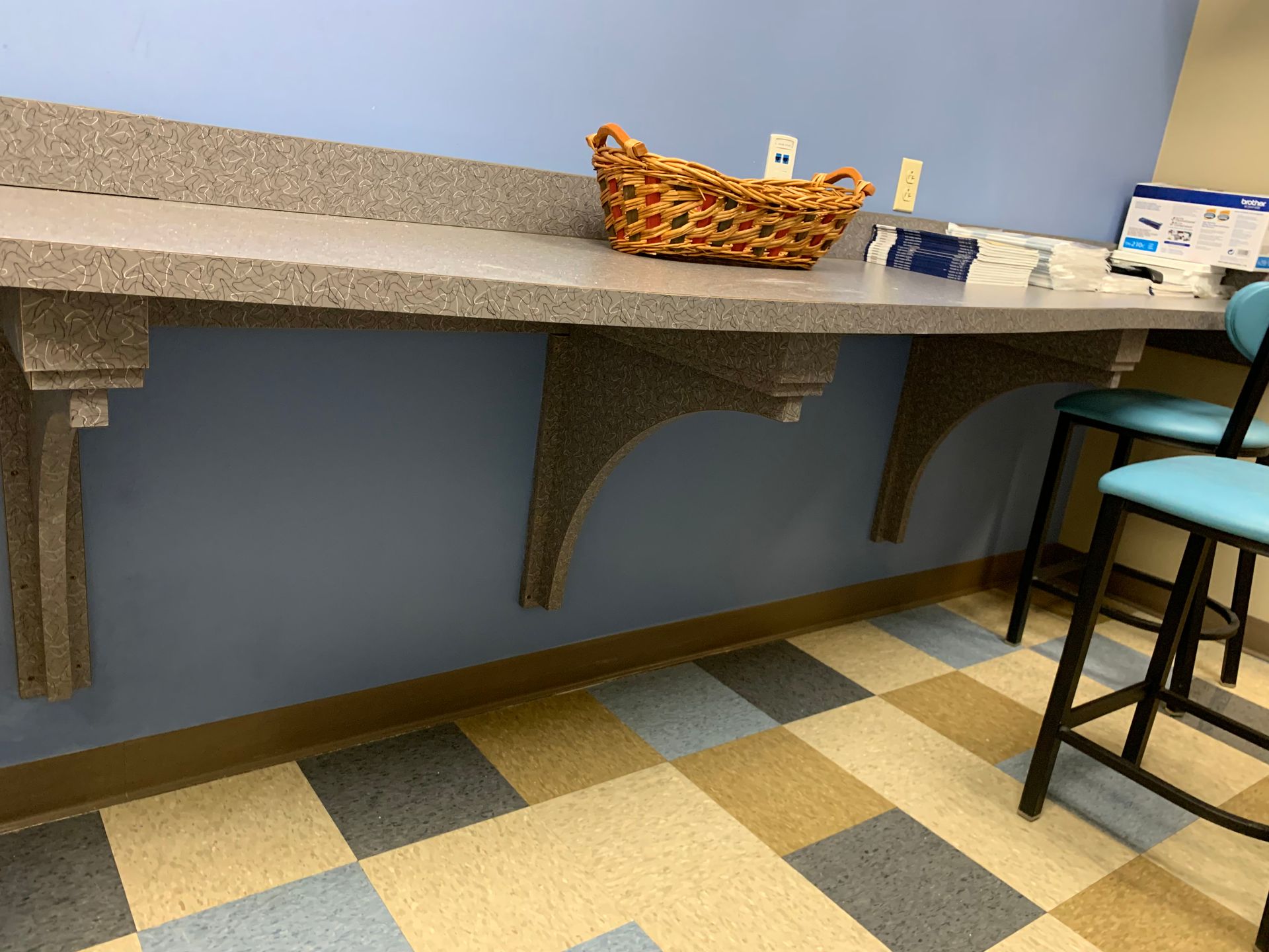 A long counter with a basket on top of it