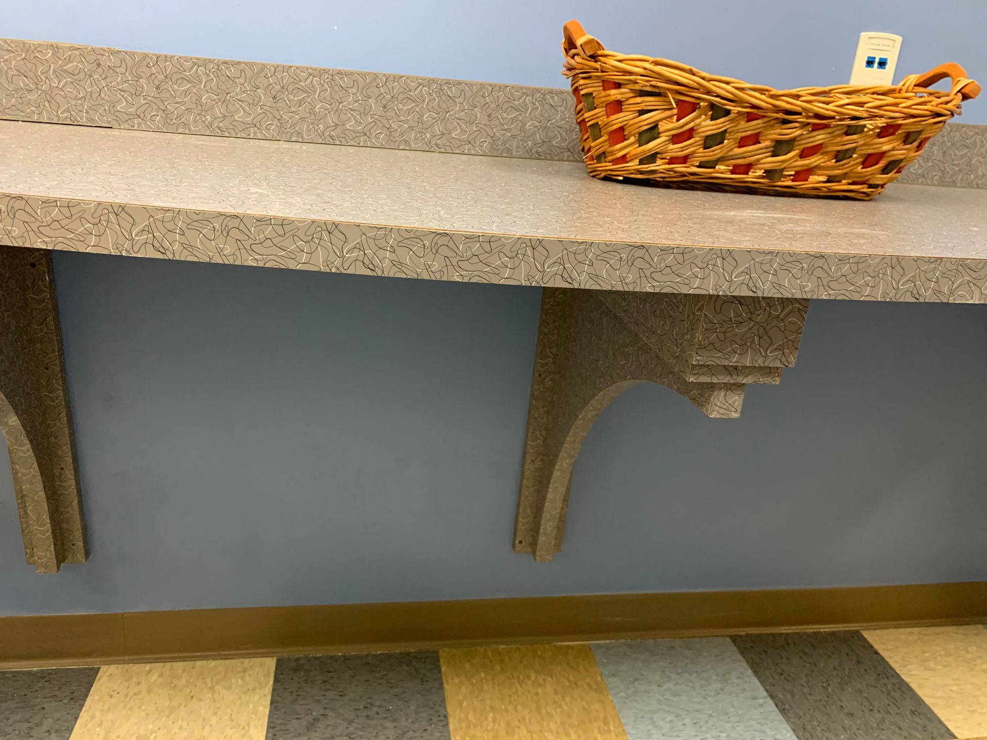 A wicker basket is sitting on top of a counter