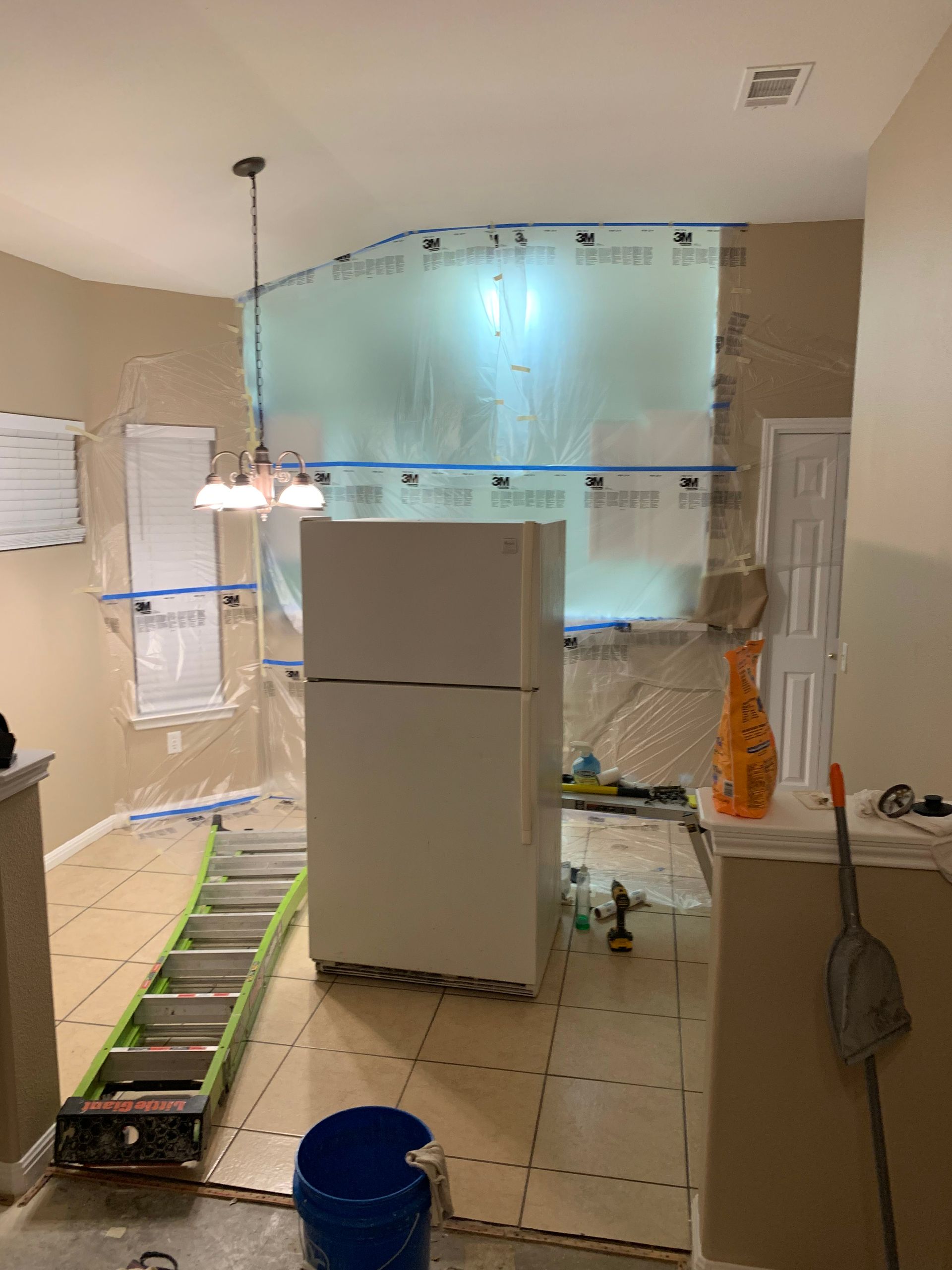 A balcony with a wooden railing and a view of a house.