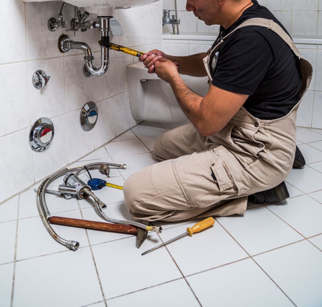 A ceiling fan is hanging from the ceiling of a wooden structure.