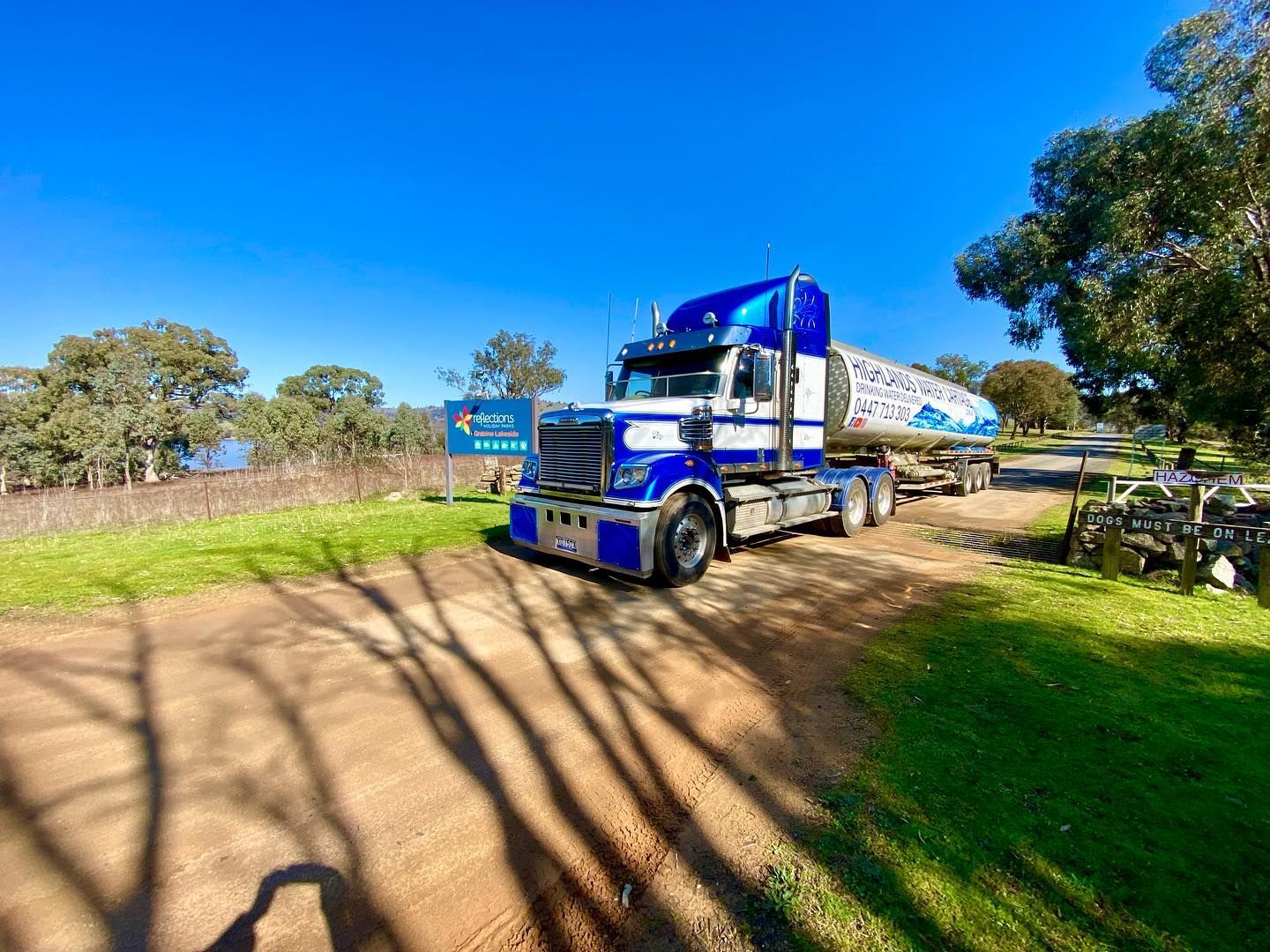 Blue and White Semi-Truck on Dirt Road — Highlands Water Cartage in South West Sydney, NSW