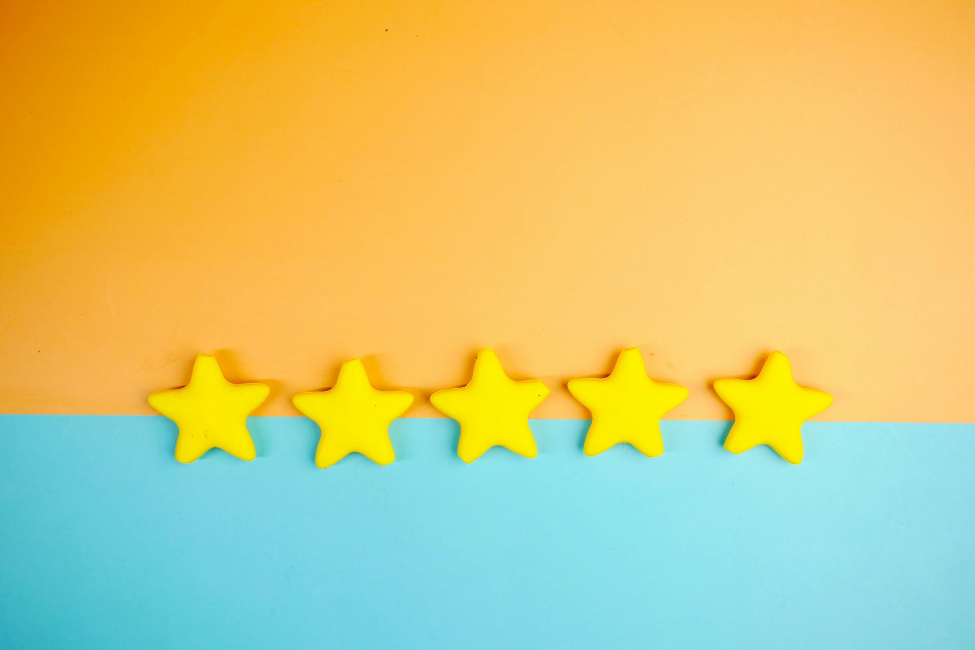 A row of yellow stars on a blue and orange background.