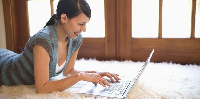 Woman searching online for carpet cleaning in Tauranga 