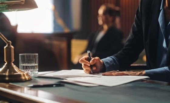 man unlocking handcuffs that bind him to a woman