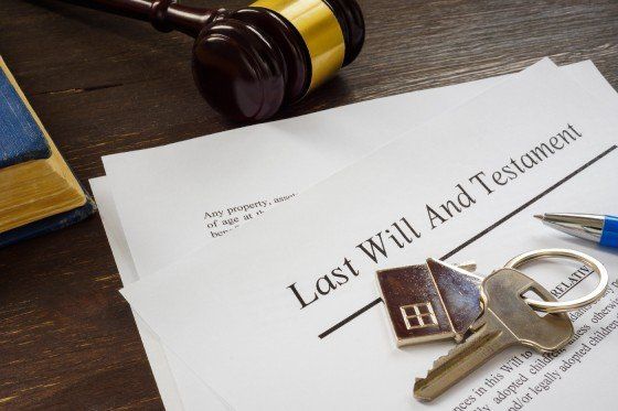 last will and testament papers and key as symbol of property