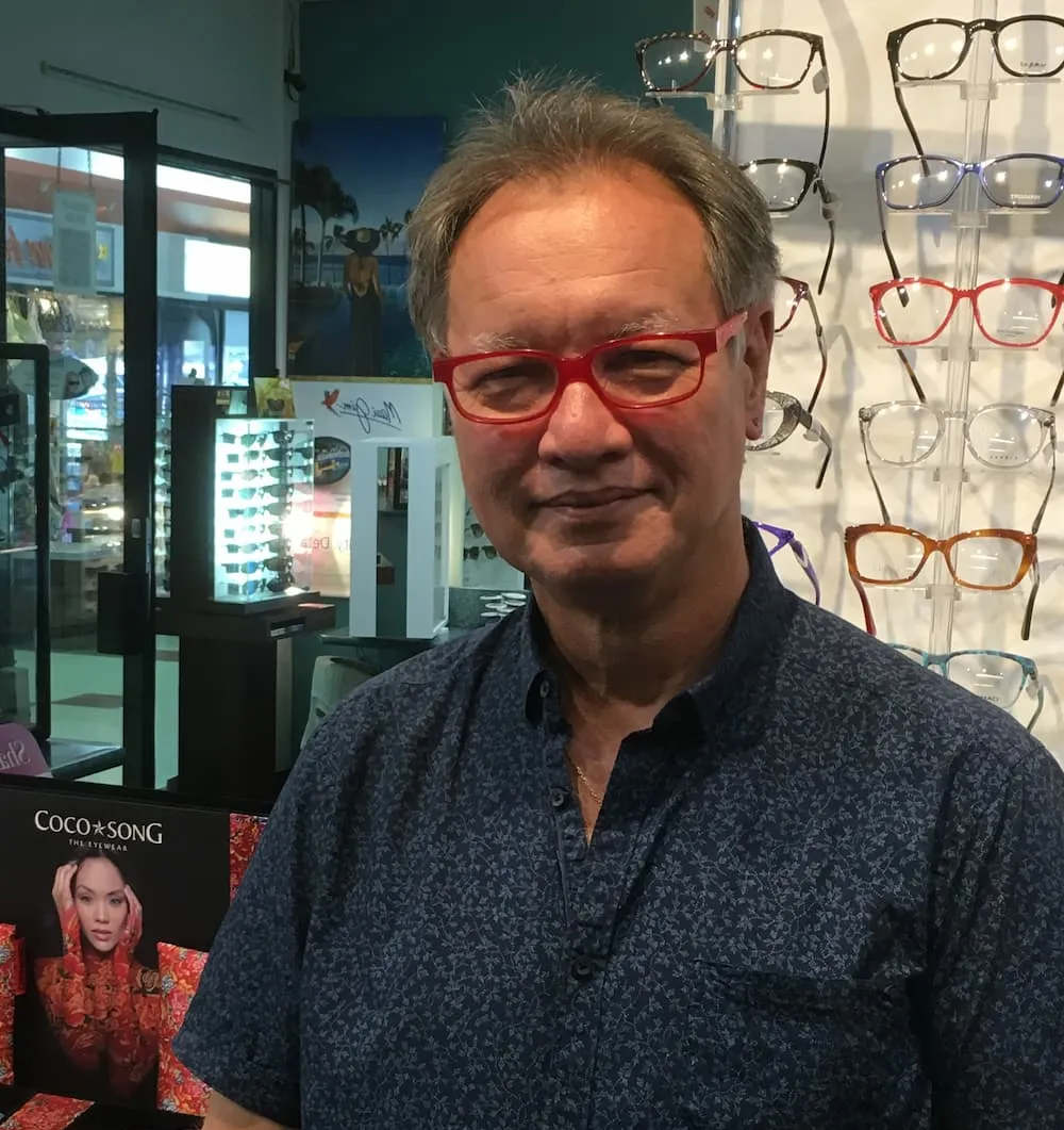 Man Wearing Red Prescription Glasses - Optometrist Expert Care in Coconut Grove, NT
