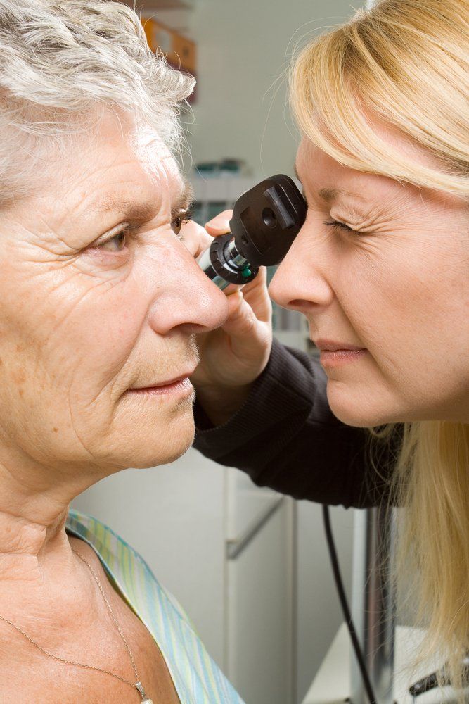 Optometrist Testing Womans Eye - Optometrist Expert Care in Coconut Grove, NT