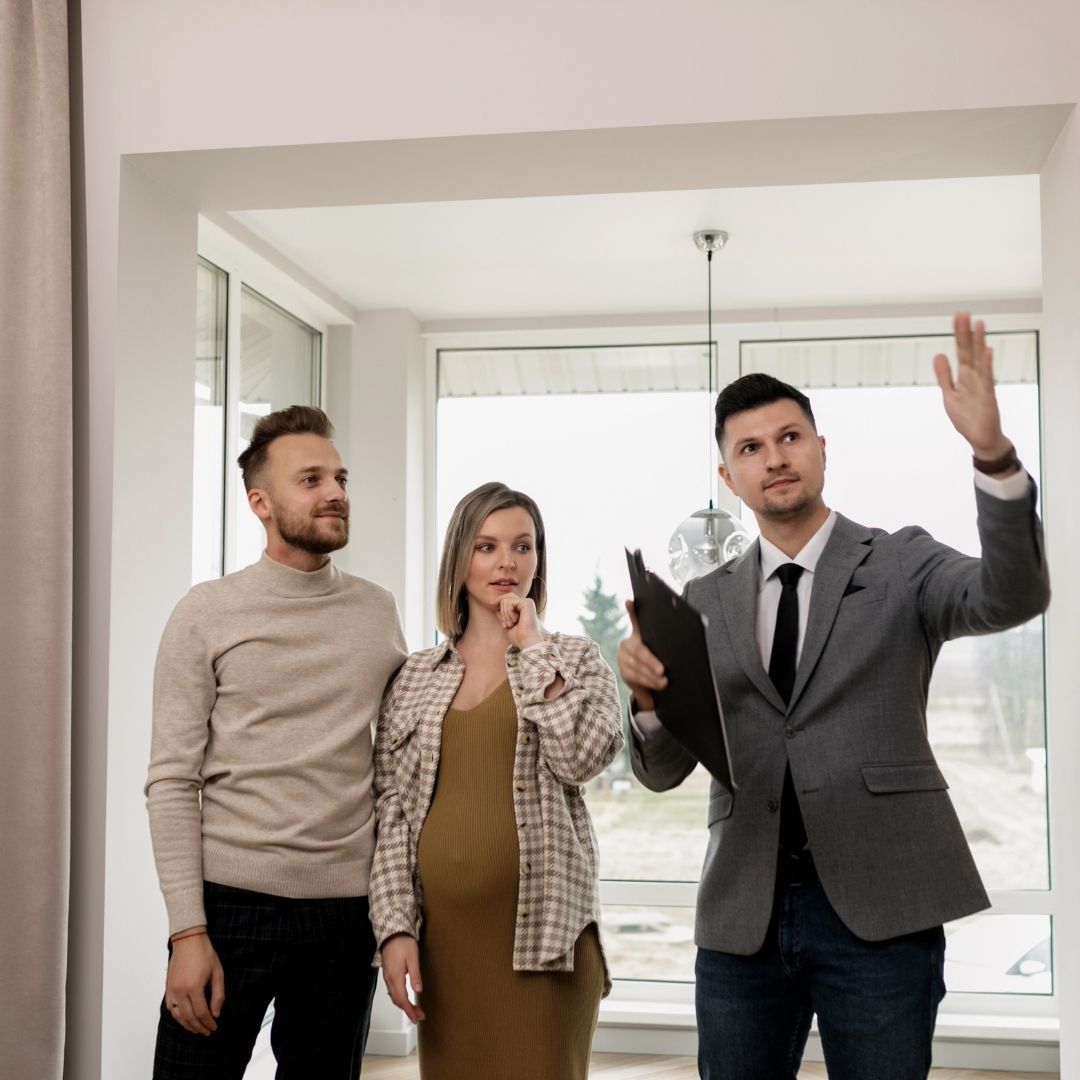property manager showing an apartment to tenants