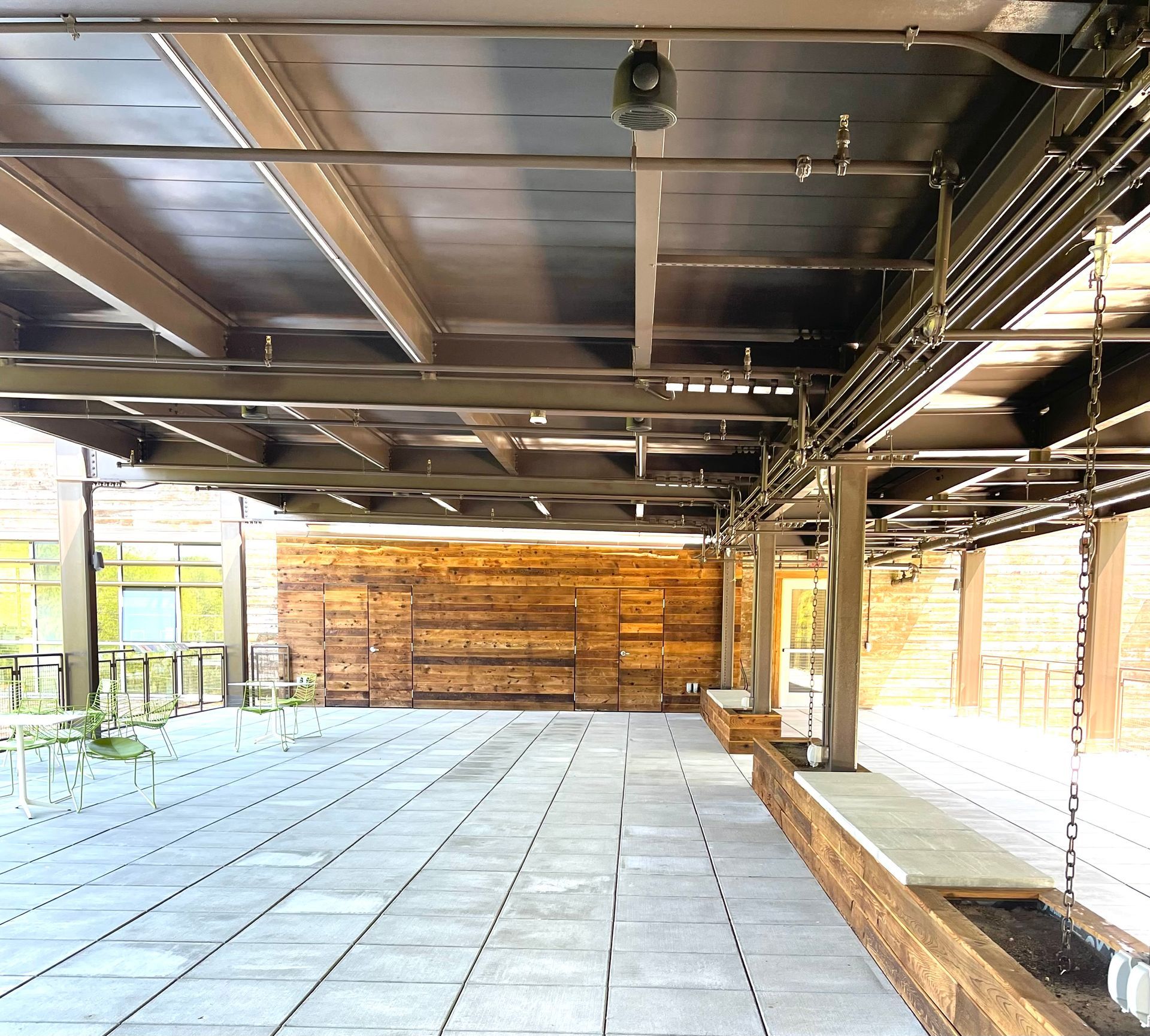 A large room with a lot of pipes hanging from the ceiling