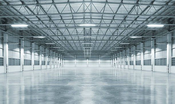 Large commercial warehouse with durable polished concrete flooring and exposed ceiling