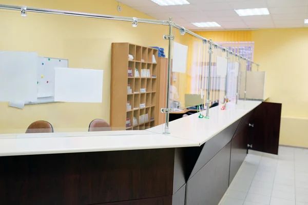 Reception counter with protective barrier in nursing home administration area,