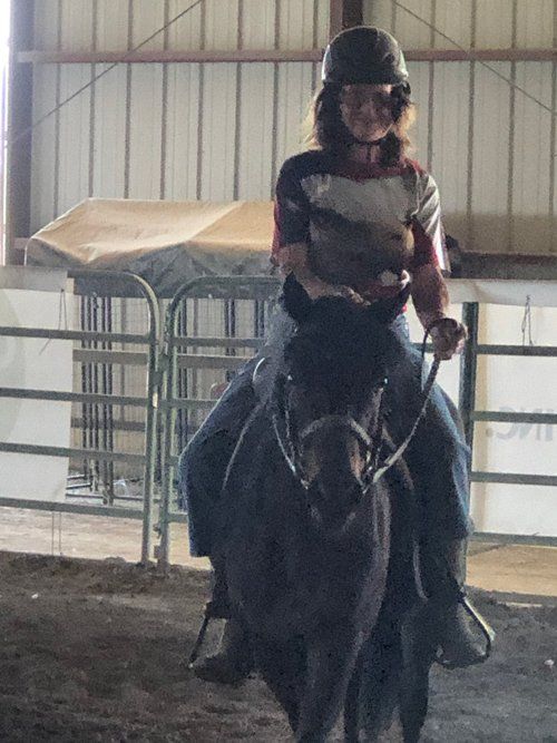 Woman Riding A Horse — Fruita, CO — Harmony Acres Equestrian Center