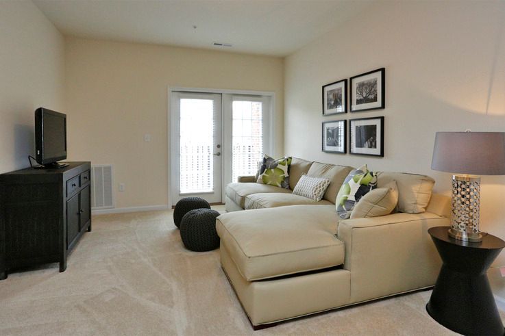 A living room with a couch and a television