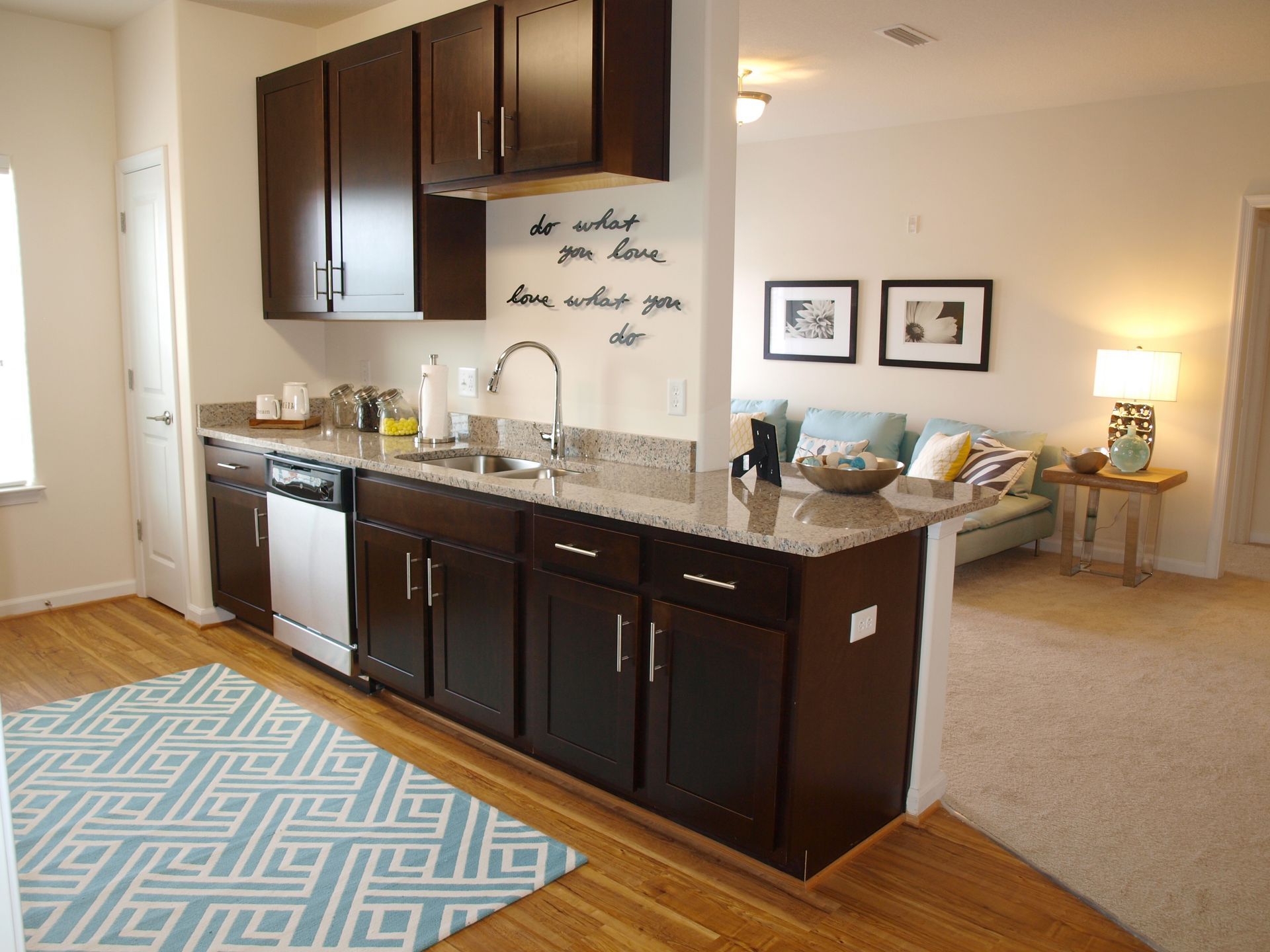 A kitchen with brown cabinets and granite counter tops