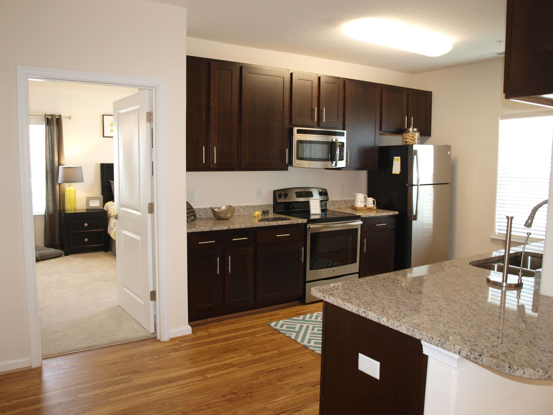 A kitchen with stainless steel appliances and granite counter tops
