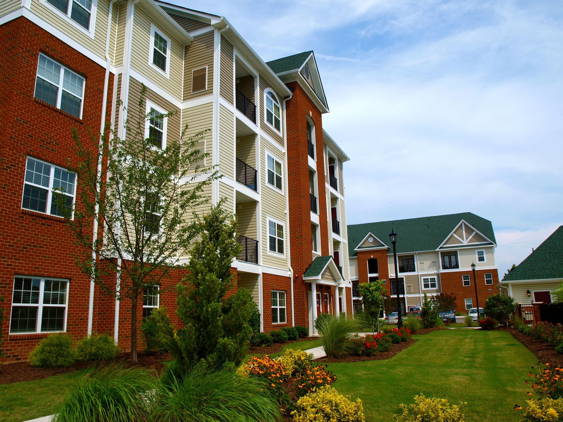 A large apartment building with a green roof
