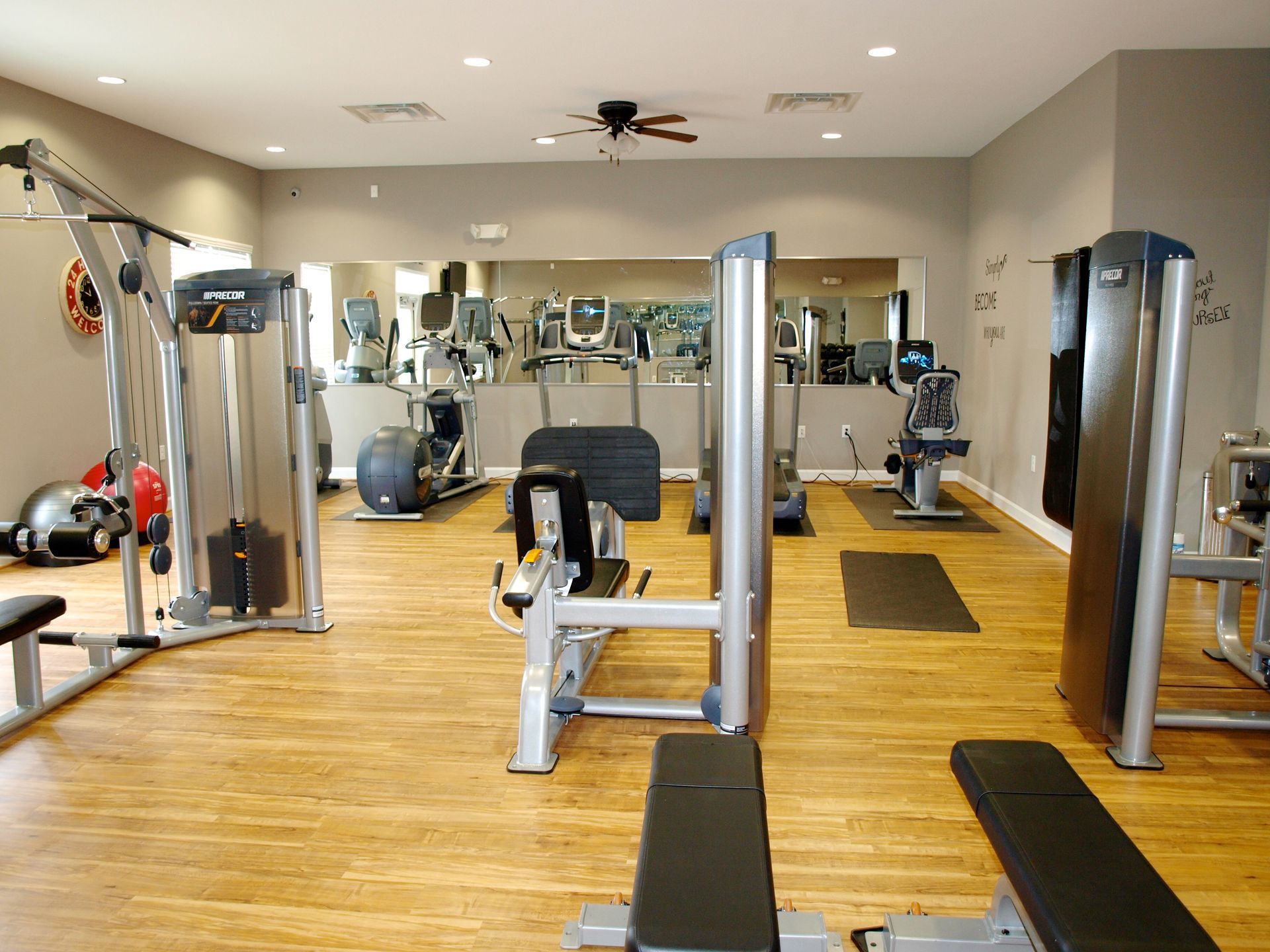 A large gym with a lot of exercise equipment