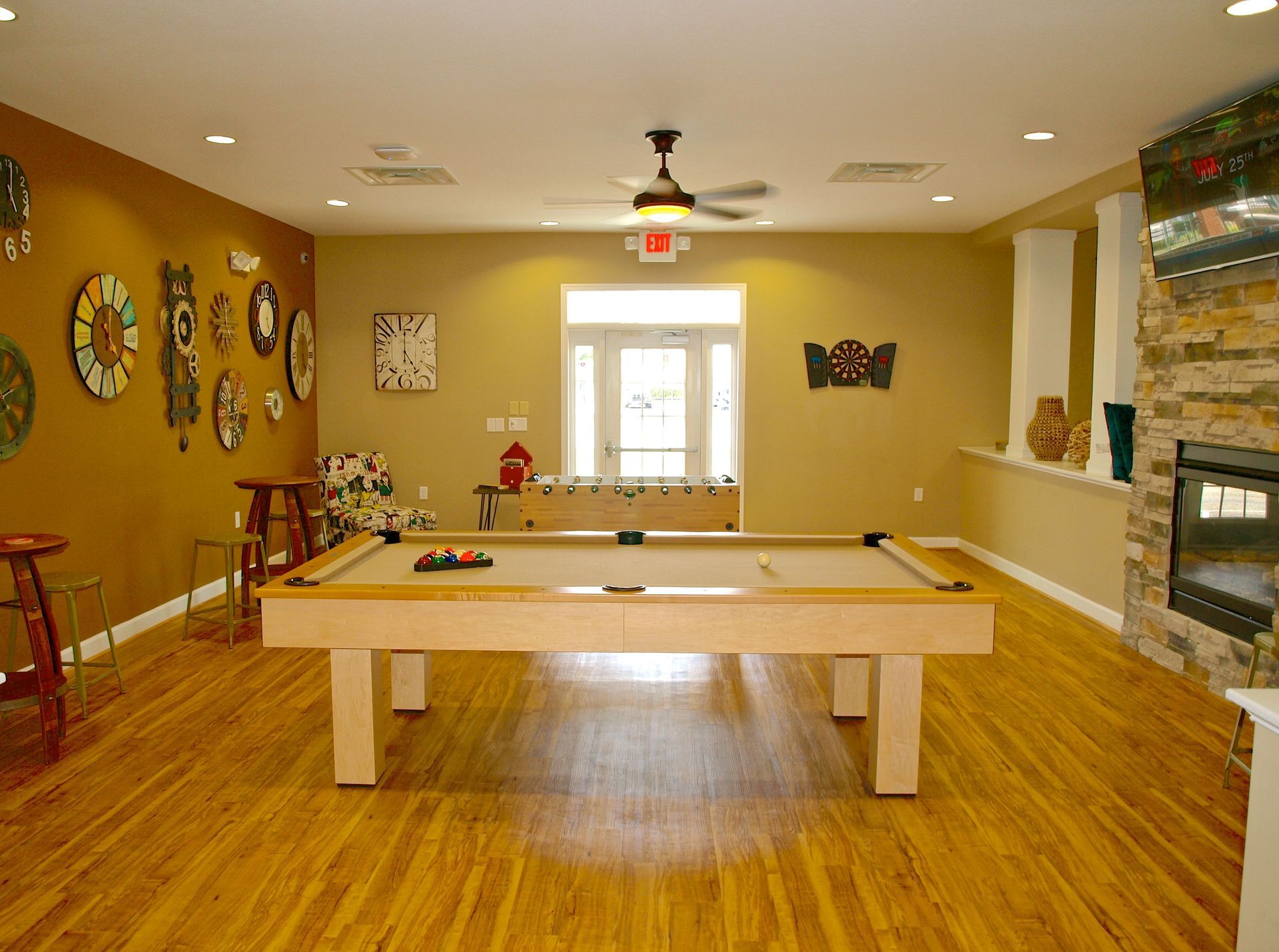 A pool table in a room with a fire place