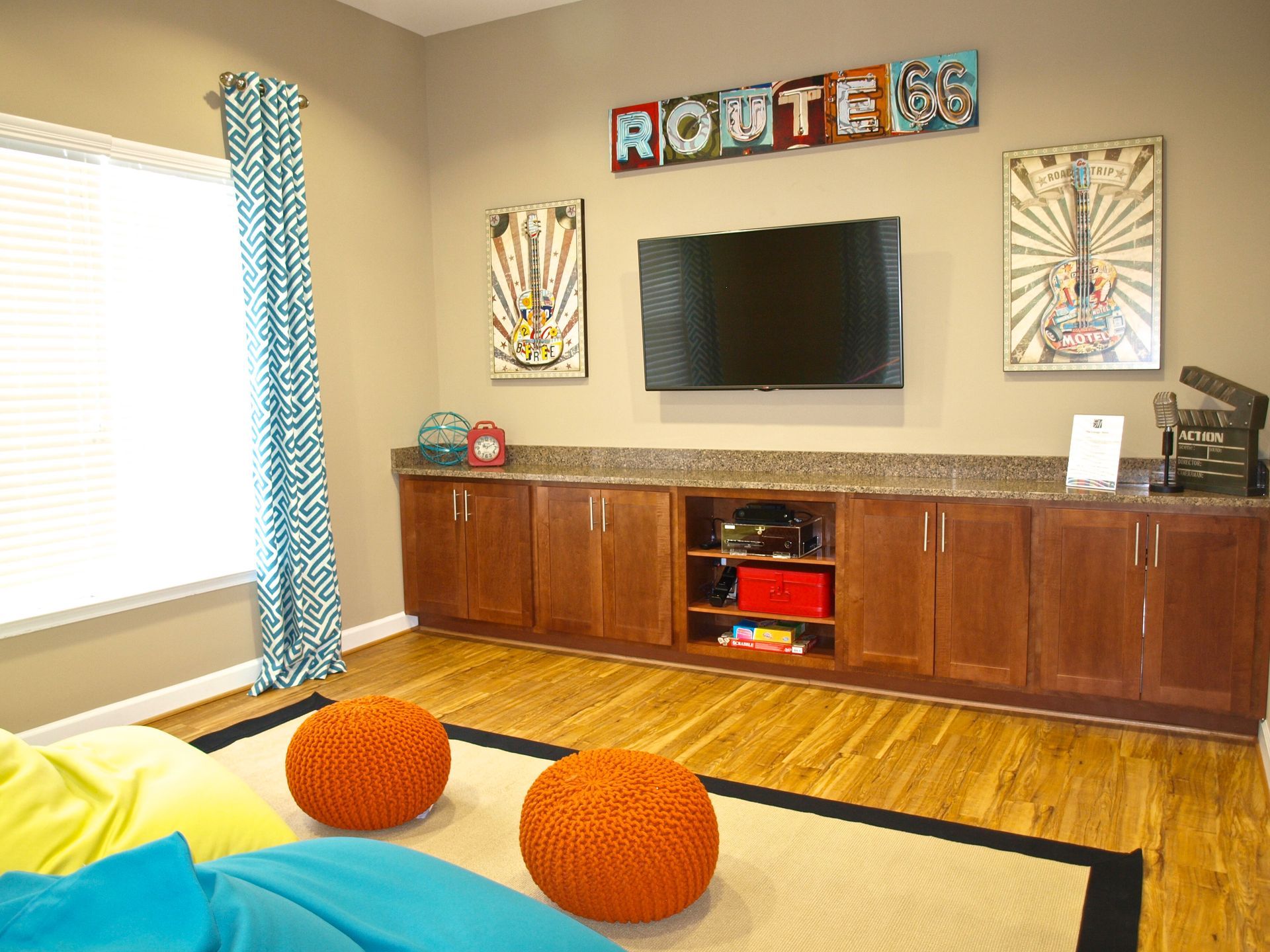 A living room with a tv and a sign that says route 66