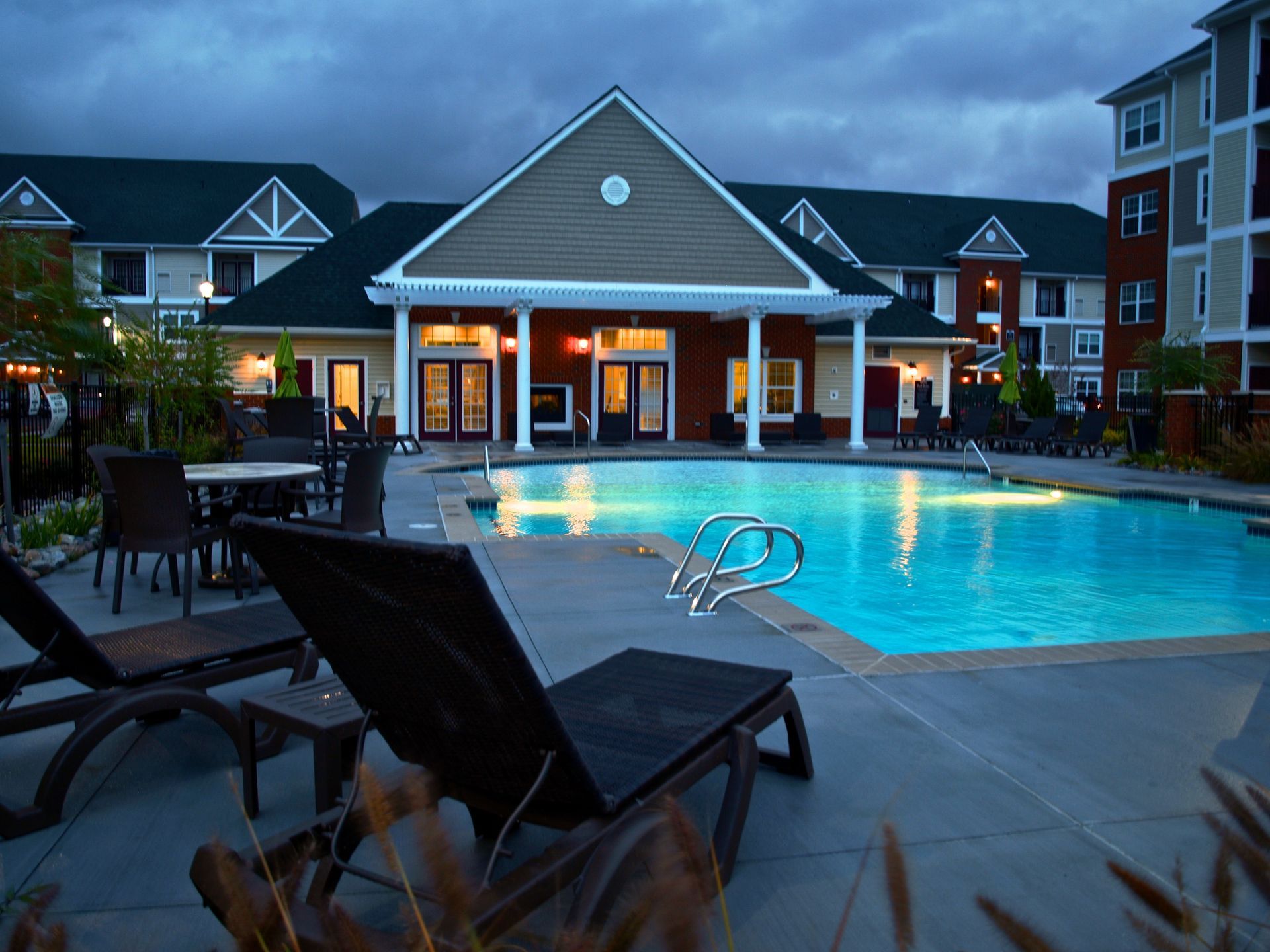 A large swimming pool in front of a large building