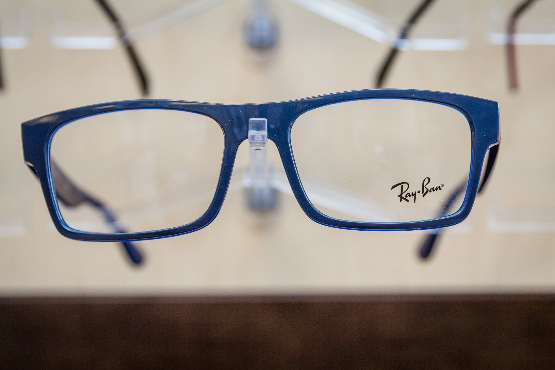 A pair of blue ray-ban glasses on display