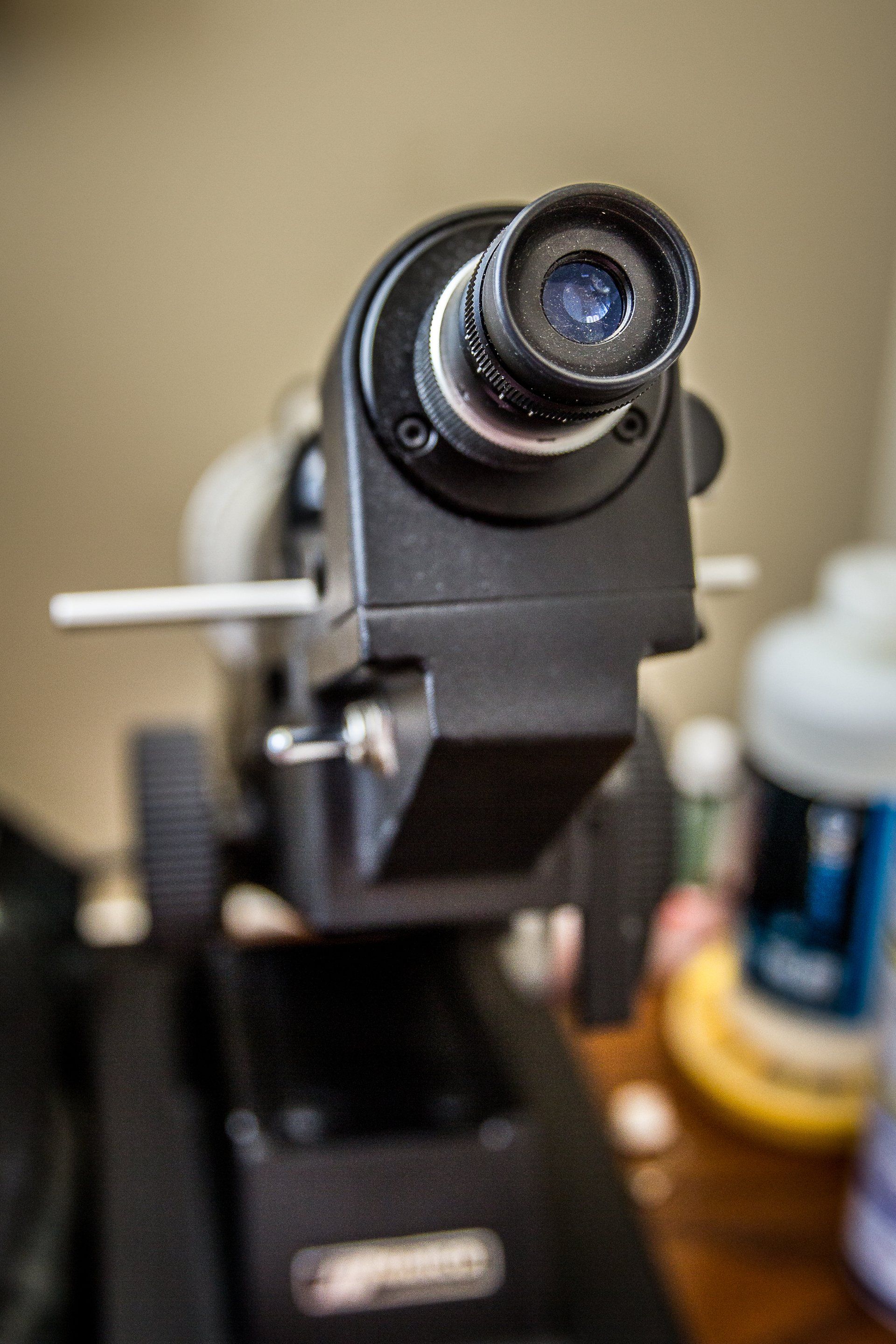 A close up of a microscope on a table