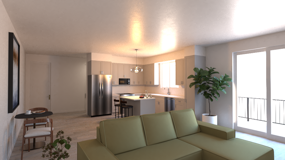 A living room with a green couch and a kitchen in the background.