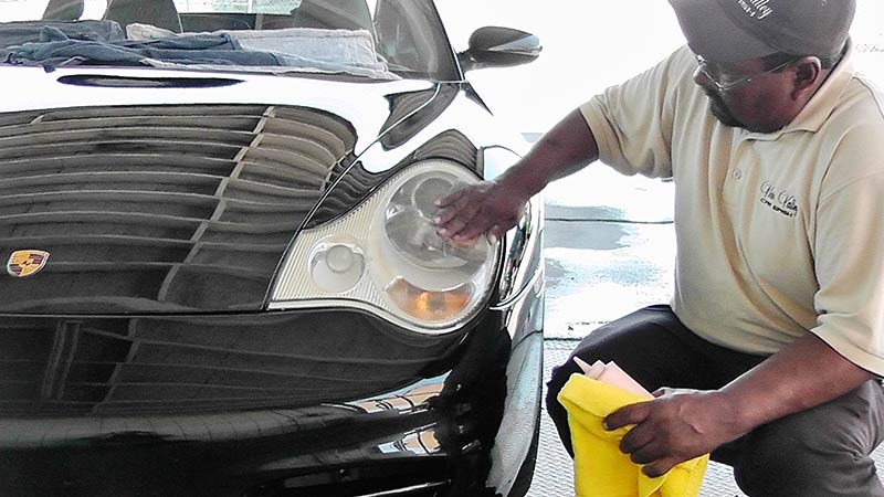 Cleaning Headlight — Car Wash in Victorville, CA