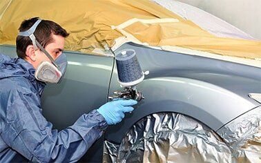 Mechanic Painting Cars Body - Auto Repair in Erie, Pennsylvania