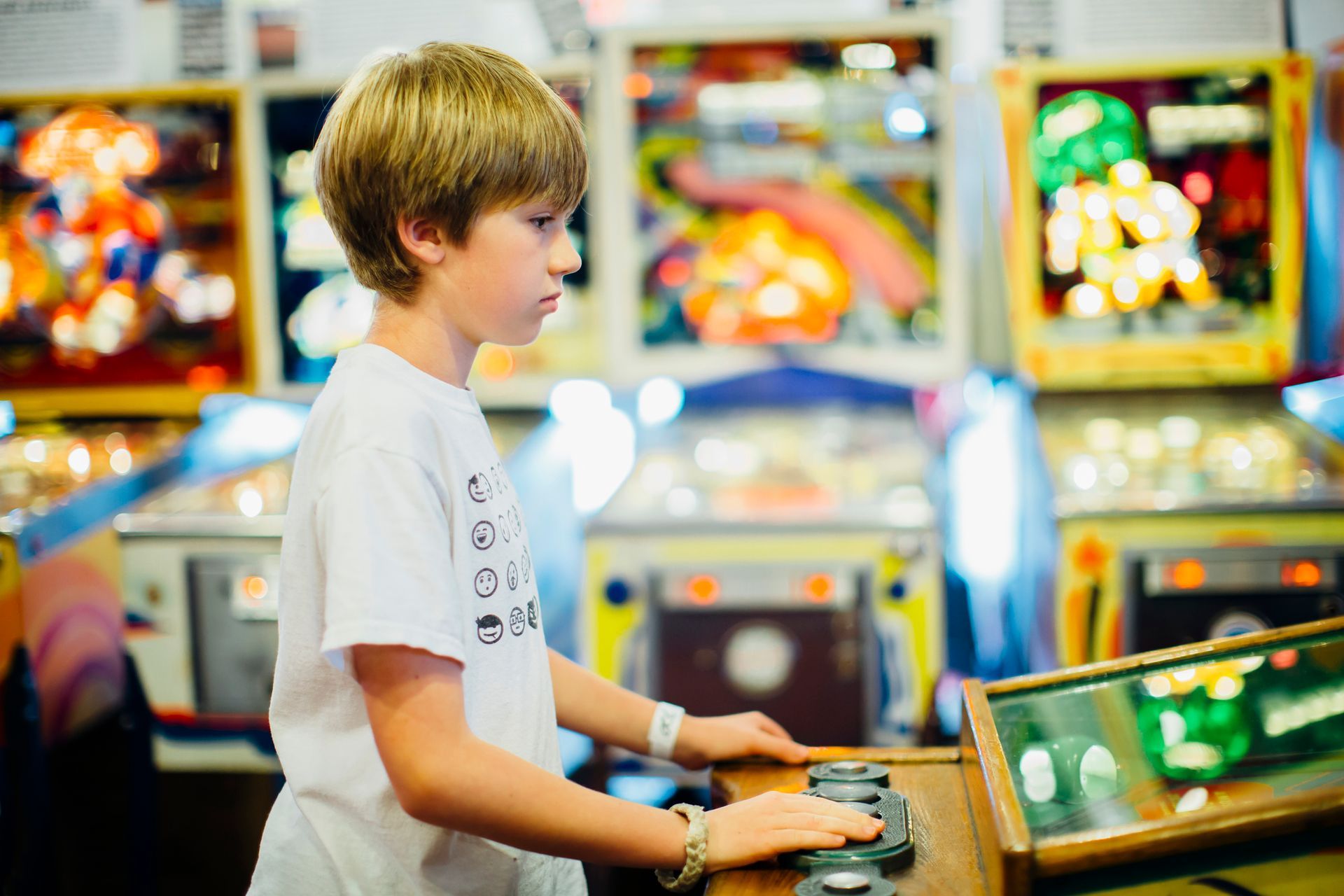 Two women are playing a slot machine in a casino.