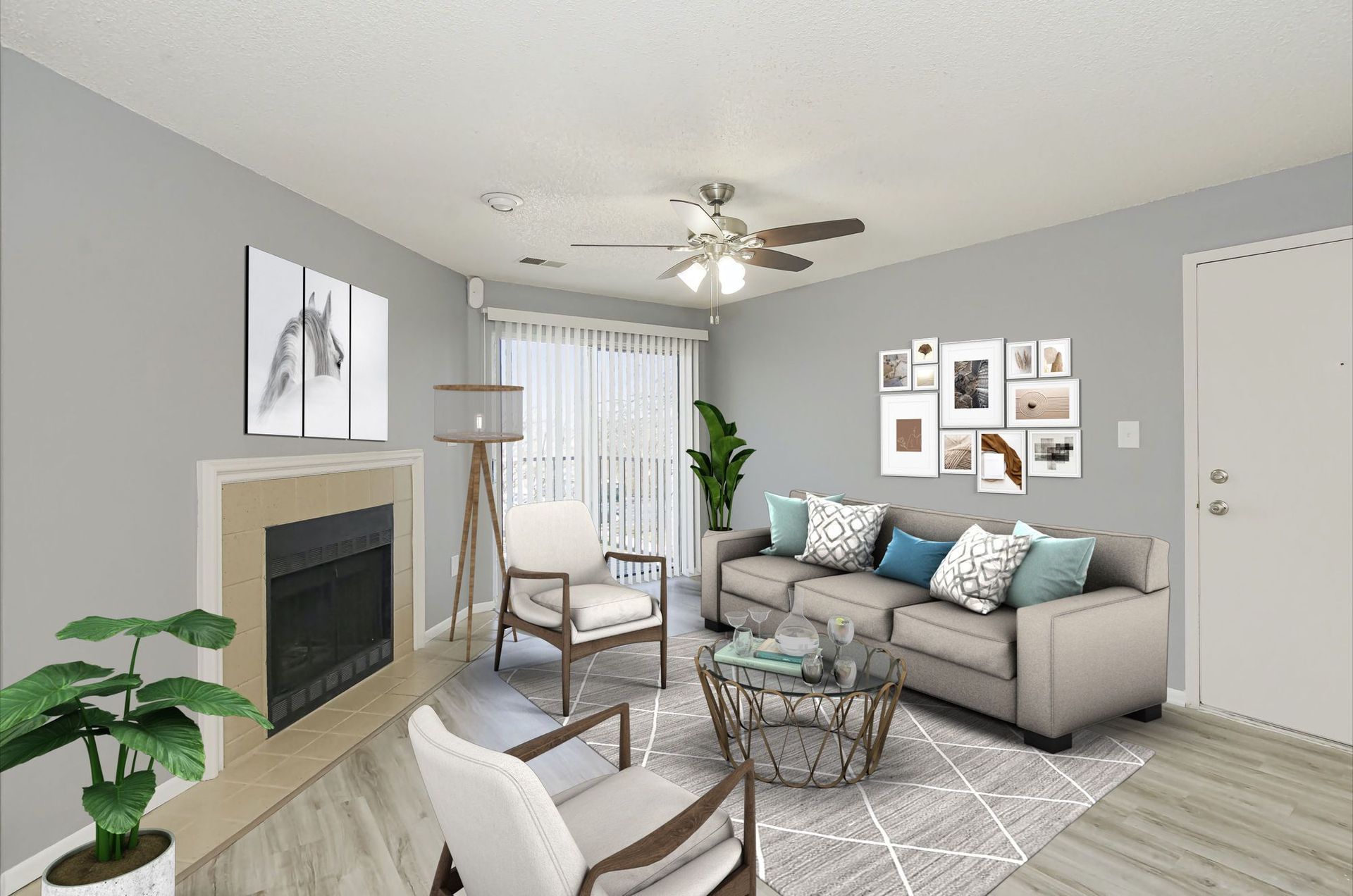 Living room with grey walls, fireplace, sofa, chairs, and gallery wall.