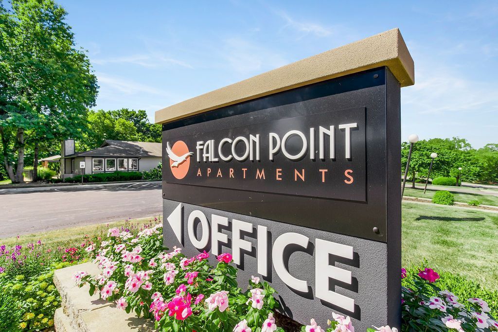 Falcon Point Apartments sign, orange logo, with 