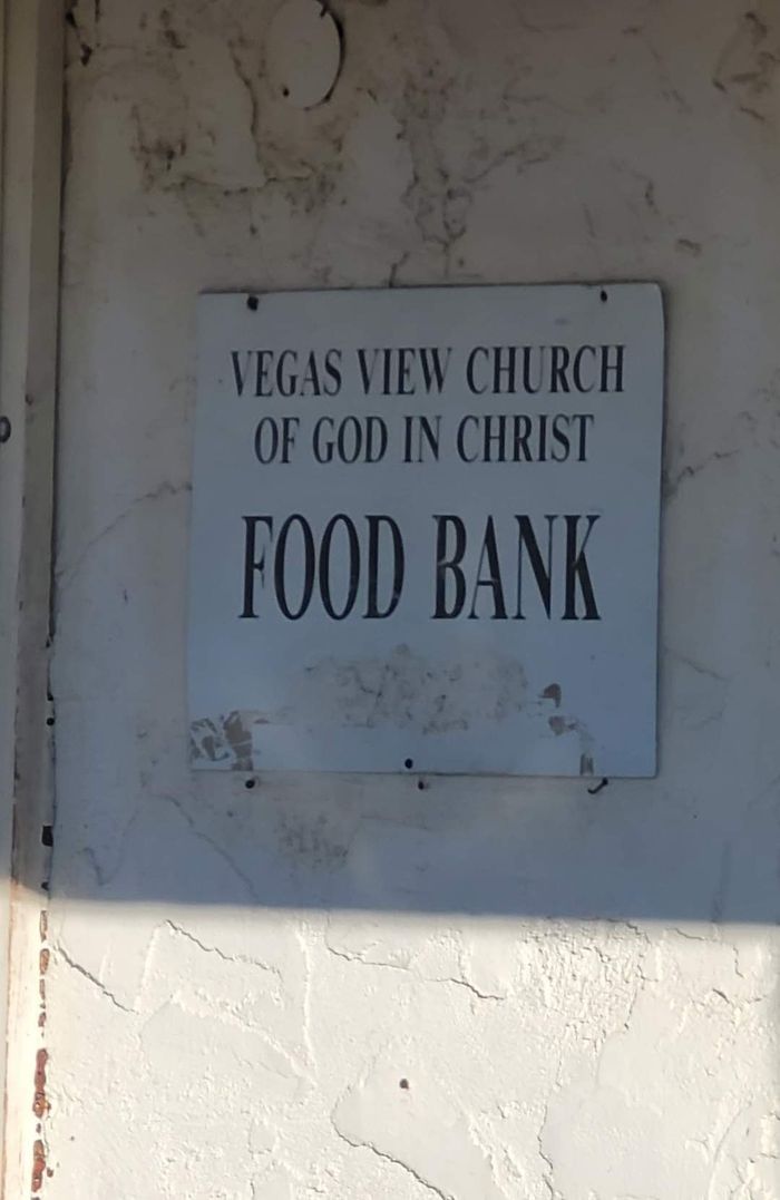 A sign for the vegas view church of god in christ food bank