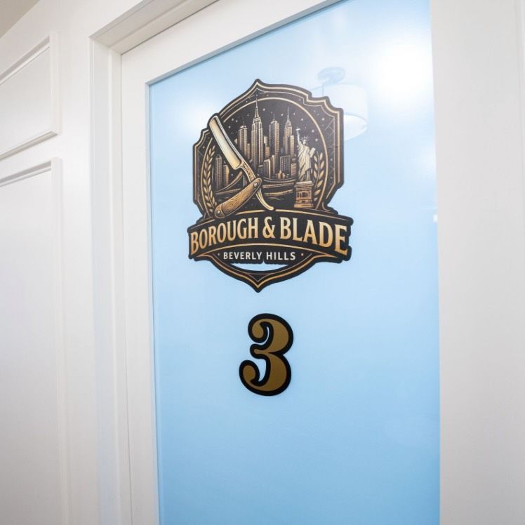 Door labeled “Borough & Blade Beverly Hills” with the number 3 on a blue background