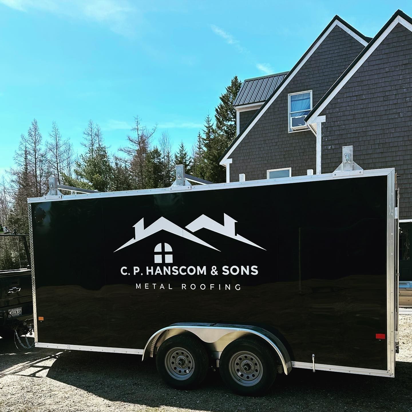 Black trailer with the logo 