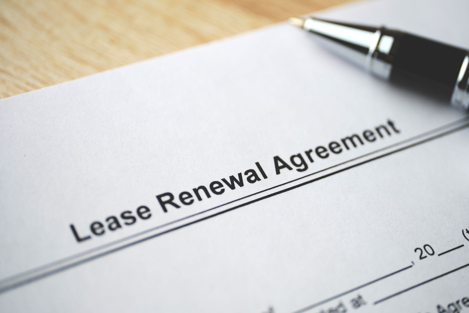 Signing a lease renewal agreement.