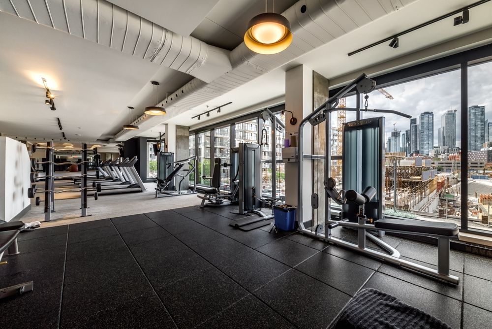 Modern apartment furnished with amenities and a workout room.