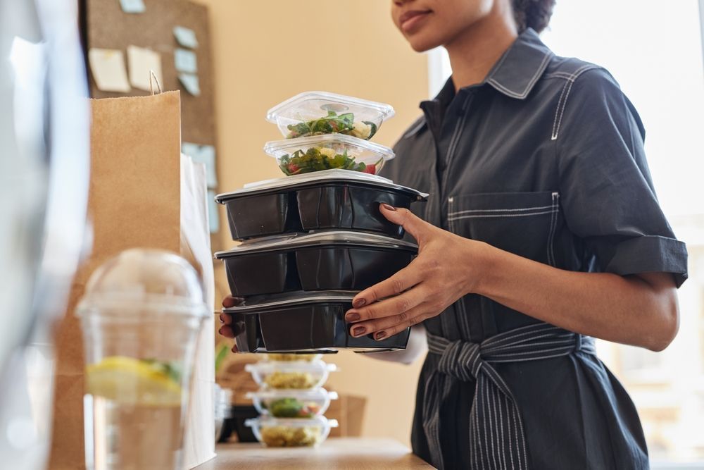 A college student meal prepping for the week.