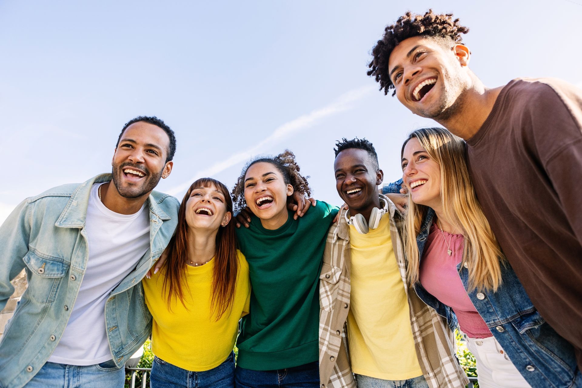 Group of friends together on a college campus.
