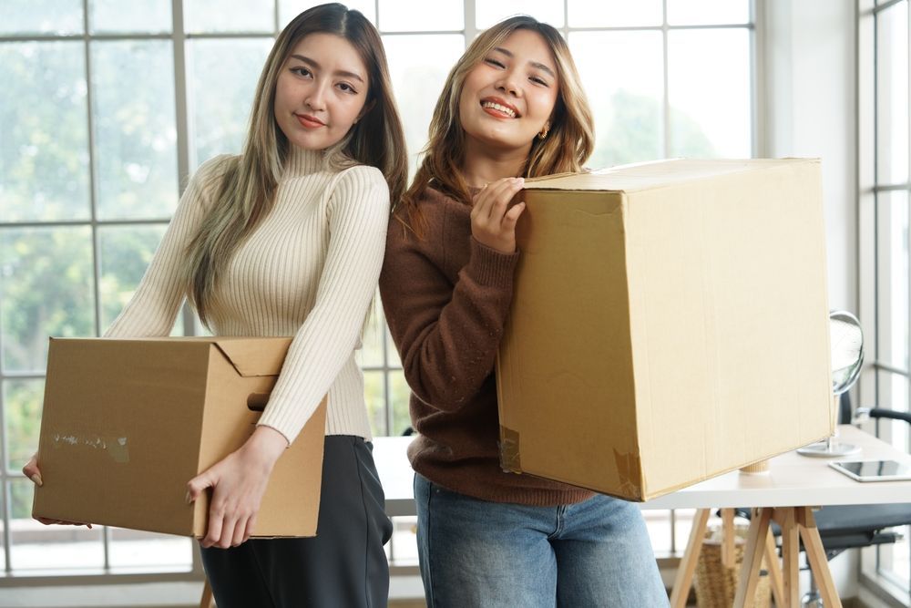 two friends/college students moving into their first college apartment