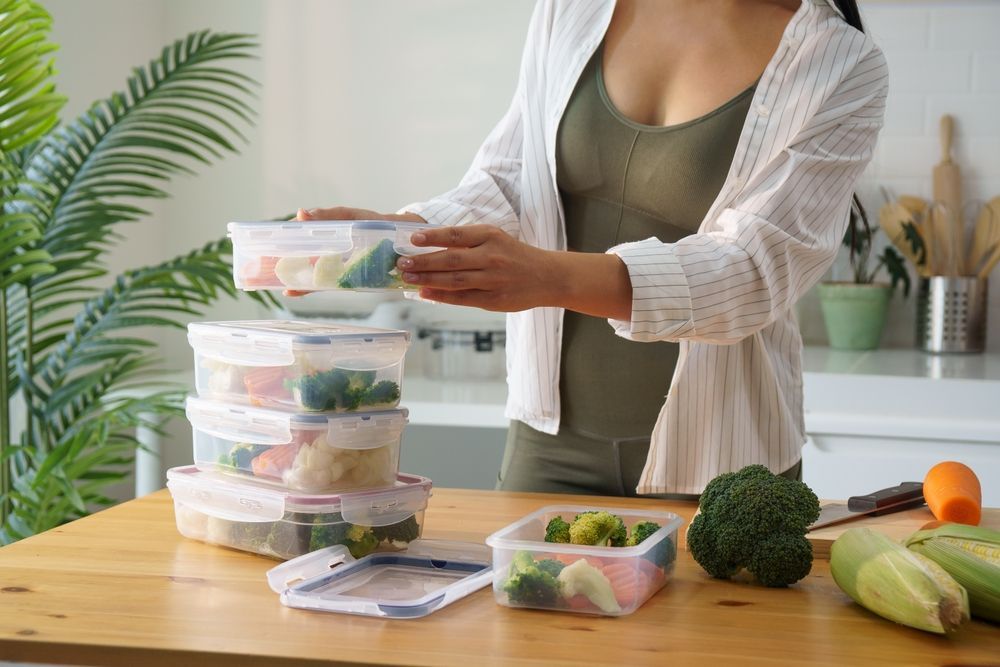 A college student is meal prepping for the week.