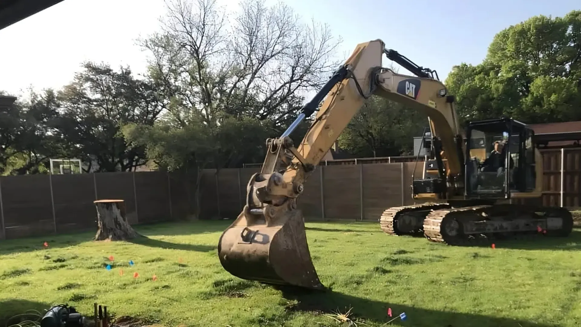 A excavator preparing to dig on a residential excavation project in Conroe, TX.