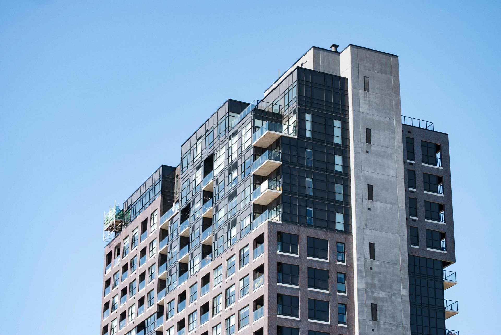 Looking up at a tall building with a blue sky in the background