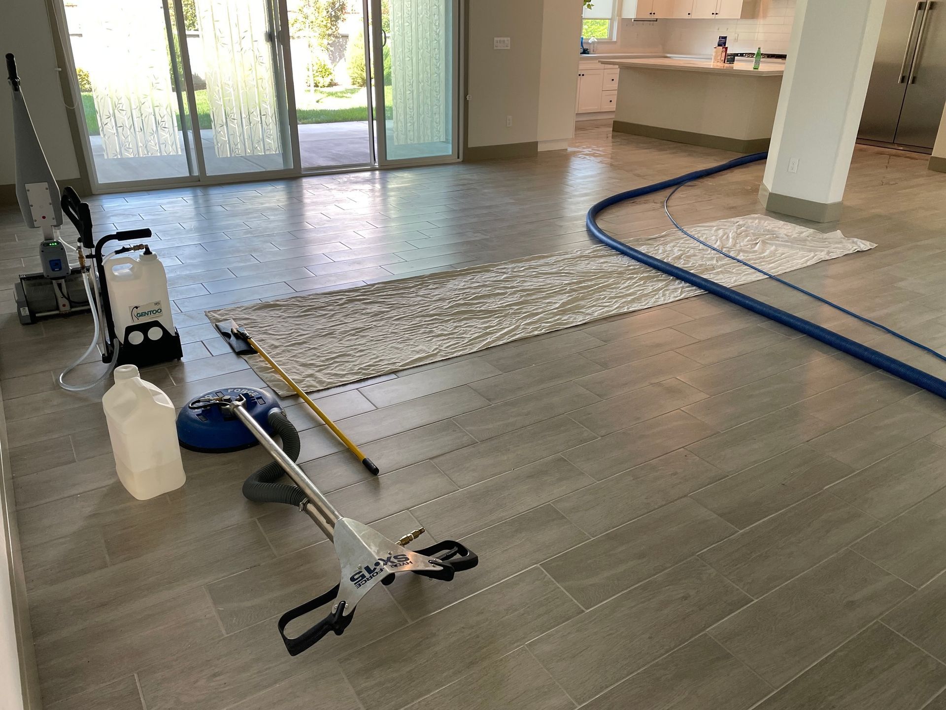 a mop is sitting on a tiled floor in a room