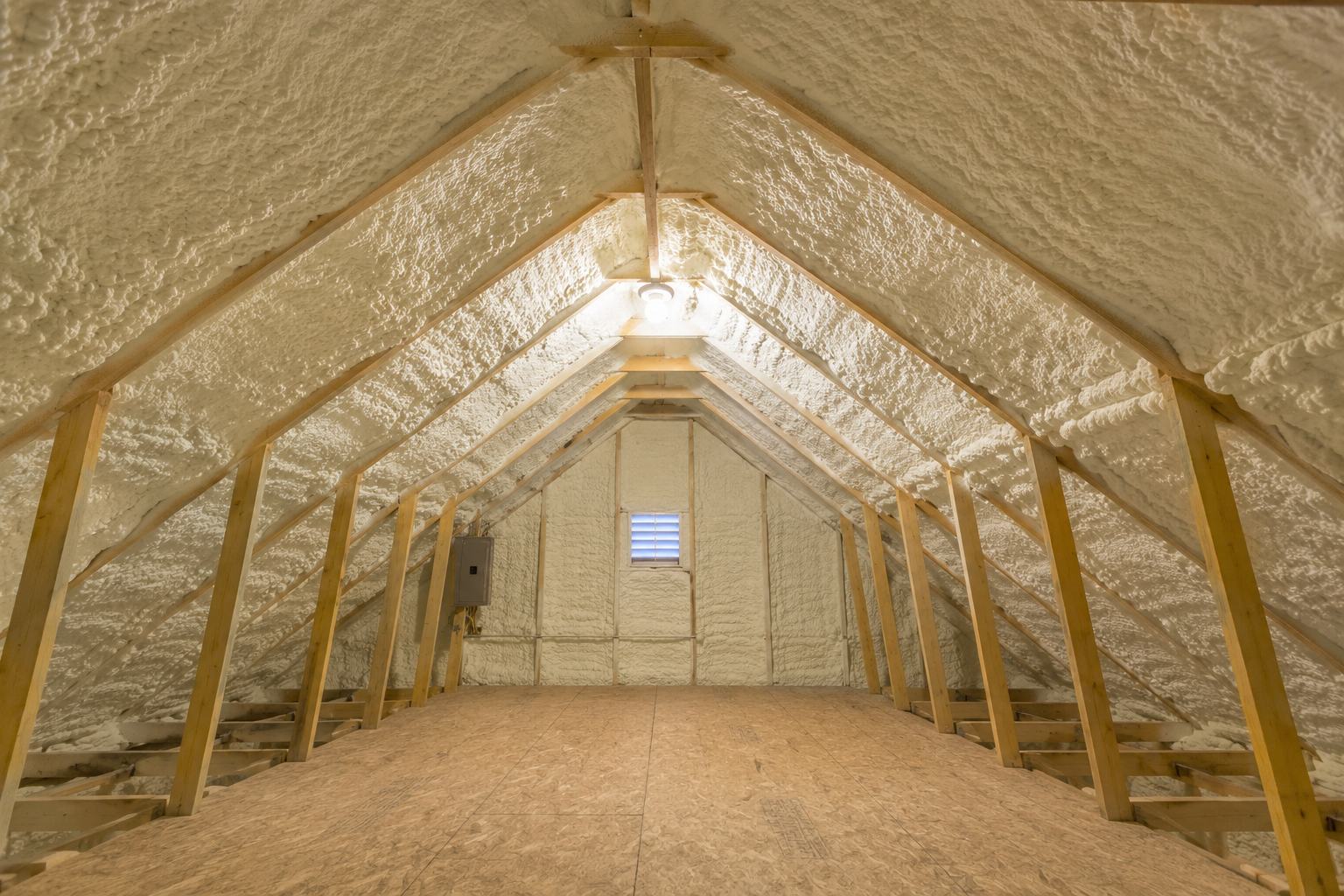 an attic fully insulated with spray foam insulation on the walls and roof
