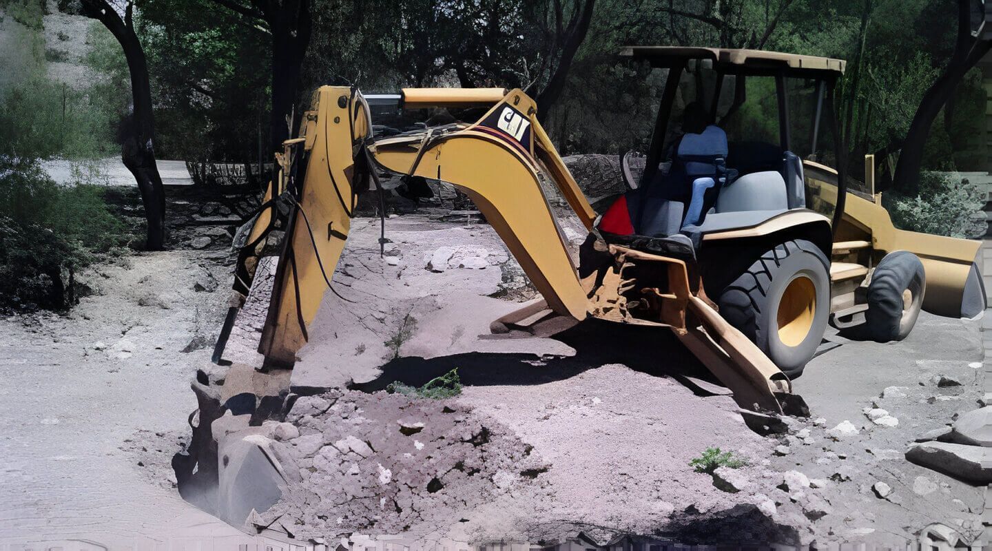 Una retroexcavadora está cavando un hoyo en la tierra