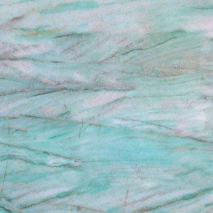 A close up of a green and white marble texture.